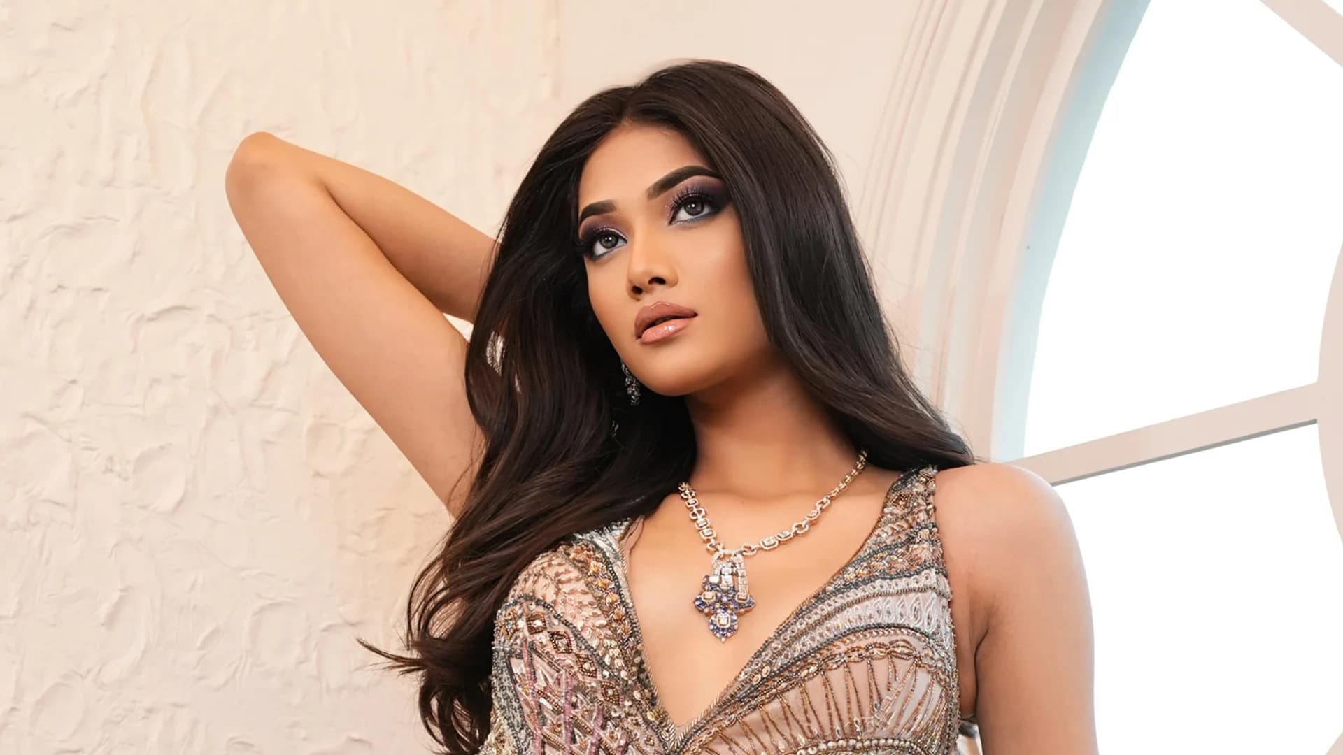 Sherly Jewels model wearing a diamond and emerald necklace