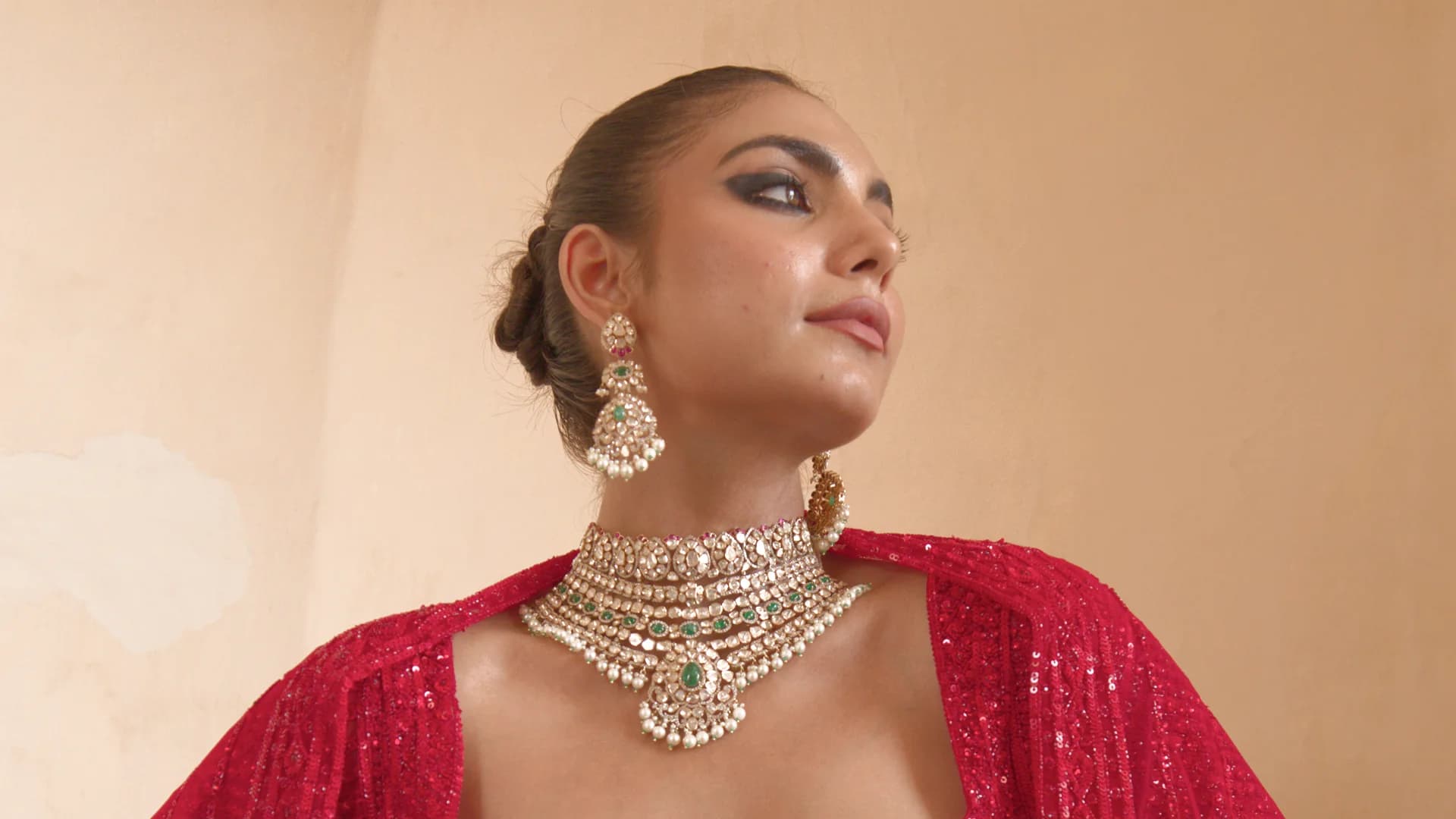 Sherly Jewels model wearing a diamond and emerald necklace