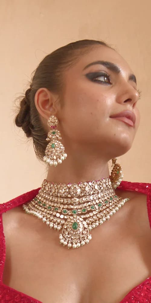 Sherly Jewels model wearing a diamond and emerald necklace